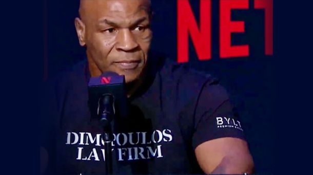 Mike Tyson wearing Dimopoulos Law t-shirt while speaking during New York Press Conferece for the upcoming fight against Jake Paul